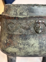 An inscribed Chinese archaic bronze food vessel and cover with double-dragon design, 'Yu Fang Ding 圉方鼎', Western Zhou
