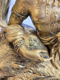 A gilt-bronze 'Oriental Beauty Reclining on a Lion Skin' mantel clock, France, first quarter 19th C.