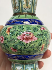 A Chinese Canton enamel green-ground three-piece altar set, 19th C.
