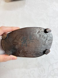 A Chinese stone group of 'Luohan' on wooden stand, Republic