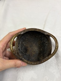 A Chinese bronze tripod 'Dragon' censer with two handles, Xuande mark, 19th C.
