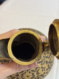 An Ottoman gilt-metal jug with stylised floral design, 19/20th C.