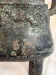 An inscribed Chinese archaic bronze food vessel and cover with double-dragon design, 'Yu Fang Ding 圉方鼎', Western Zhou