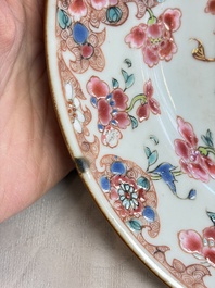 Eight Chinese famille rose plates with floral design and a 'Rooster' teapot, Yongzheng/Qianlong