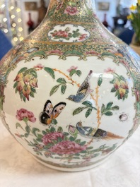 A Chinese Canton famille rose covered bottle vase and a teapot, 19th C.