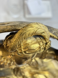 A gilt-bronze 'Oriental Beauty Reclining on a Lion Skin' mantel clock, France, first quarter 19th C.