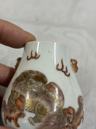 A Chinese gilt-decorated iron-red 'Buddhist Lions' snuff bottle with a red coral stopper, Buddhist Lion mark, Republic