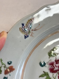 Eight Chinese famille rose plates with floral design and a 'Rooster' teapot, Yongzheng/Qianlong