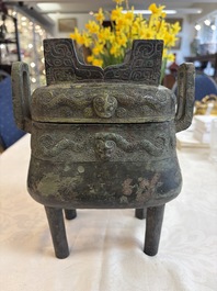 An inscribed Chinese archaic bronze food vessel and cover with double-dragon design, 'Yu Fang Ding 圉方鼎', Western Zhou