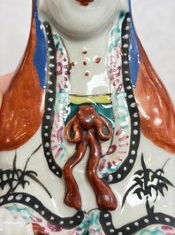 Six Chinese famille rose figures, one with a 'Lotus Throne' stand, 19th C.