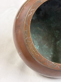 A Chinese or Vietnamese silver-inlaid bronze 'Fu Lu Shou' tripod censer,  Xuande mark, 19th C.