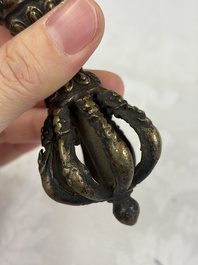 A varied collection of 14 Tibetan ritual utensils, 19/20th C.