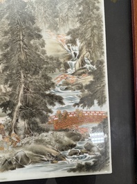 A Japanese gilt polychrome-decorated 'Mountainous landscape' porcelain plaque, Nikkozan 日光山 mark, Meiji, 19th C.