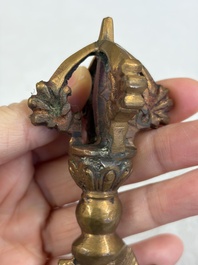 A varied collection of 14 Tibetan ritual utensils, 19/20th C.