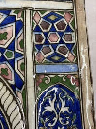 A very large inscribed rectangular moulded Qajar 'mihrab' tile inscribed Sultan Abu Saeed Khan, 19th C.