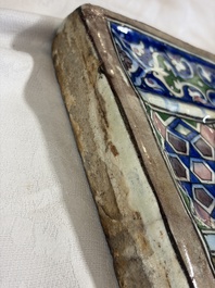 A very large inscribed rectangular moulded Qajar 'mihrab' tile inscribed Sultan Abu Saeed Khan, 19th C.