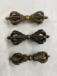 A varied collection of 14 Tibetan ritual utensils, 19/20th C.