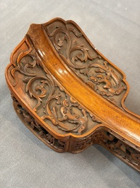 A pair of Chinese jade-inset wooden table screens, a jade-inset wooden ruyi with its original stand and a jade 'bi' disc on a wooden stand, 19/20th C.