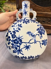 A Chinese blue and white moonflask vase and a wucai garlic-mouth bottle vase, Yongle and Wanli mark, 20th C.