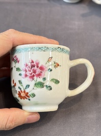 A Chinese famille rose teapot and cover with floral design and three cups, Qianlong