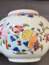 A Chinese famille rose teapot and cover with floral design and three cups, Qianlong