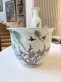 A Chinese famille rose vase, a covered jar and a jardiniere with stand, 19/20th C.