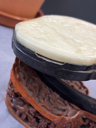 A pair of Chinese jade-inset wooden table screens, a jade-inset wooden ruyi with its original stand and a jade 'bi' disc on a wooden stand, 19/20th C.