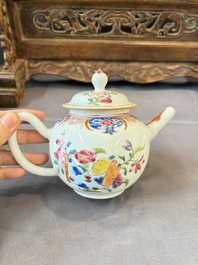 A Chinese famille rose teapot and cover with floral design and three cups, Qianlong
