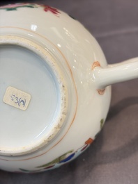 A Chinese famille rose teapot and cover with floral design and three cups, Qianlong