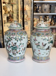 A pair of Chinese famille rose 'Roosters' vases and covers, 19th C.