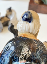 A Chinese polychrome-glazed Shiwan stoneware figure of Tudigong, a 'Shoulao' group and a 'Go Players' group, China marks, 19/20th C.