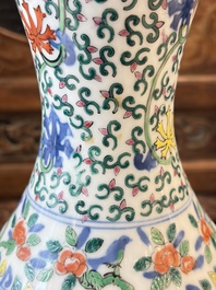 A Chinese blue and white moonflask vase and a wucai garlic-mouth bottle vase, Yongle and Wanli mark, 20th C.