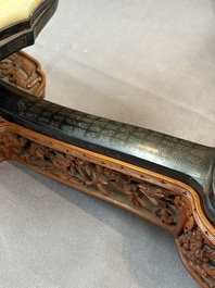 A pair of Chinese jade-inset wooden table screens, a jade-inset wooden ruyi with its original stand and a jade 'bi' disc on a wooden stand, 19/20th C.