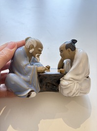 A Chinese polychrome-glazed Shiwan stoneware figure of Tudigong, a 'Shoulao' group and a 'Go Players' group, China marks, 19/20th C.