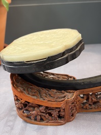A pair of Chinese jade-inset wooden table screens, a jade-inset wooden ruyi with its original stand and a jade 'bi' disc on a wooden stand, 19/20th C.