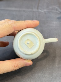 A Chinese famille rose teapot and cover with floral design and three cups, Qianlong