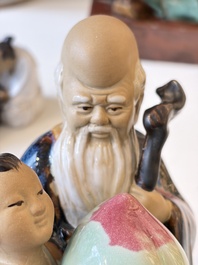 A Chinese polychrome-glazed Shiwan stoneware figure of Tudigong, a 'Shoulao' group and a 'Go Players' group, China marks, 19/20th C.