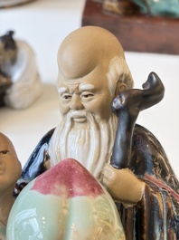 A Chinese polychrome-glazed Shiwan stoneware figure of Tudigong, a 'Shoulao' group and a 'Go Players' group, China marks, 19/20th C.