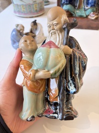 A Chinese polychrome-glazed Shiwan stoneware figure of Tudigong, a 'Shoulao' group and a 'Go Players' group, China marks, 19/20th C.