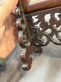 A pair of Chinese jade-inset wooden table screens, a jade-inset wooden ruyi with its original stand and a jade 'bi' disc on a wooden stand, 19/20th C.