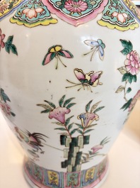 A pair of Chinese famille rose 'Roosters' vases and covers, 19th C.