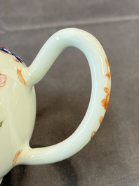 A Chinese famille rose teapot and cover with floral design and three cups, Qianlong