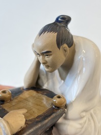A Chinese polychrome-glazed Shiwan stoneware figure of Tudigong, a 'Shoulao' group and a 'Go Players' group, China marks, 19/20th C.