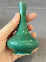 A Chinese green crackle-glazed vase on wooden stand and two famille rose 'Roosters' and 'Antiquities' water pots, 19th C.