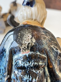 A Chinese polychrome-glazed Shiwan stoneware figure of Tudigong, a 'Shoulao' group and a 'Go Players' group, China marks, 19/20th C.