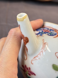 A Chinese famille rose teapot and cover with floral design and three cups, Qianlong