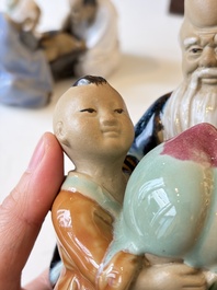 A Chinese polychrome-glazed Shiwan stoneware figure of Tudigong, a 'Shoulao' group and a 'Go Players' group, China marks, 19/20th C.