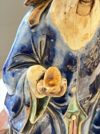 A Chinese polychrome-glazed Shiwan stoneware figure of Tudigong, a 'Shoulao' group and a 'Go Players' group, China marks, 19/20th C.