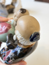 A Chinese polychrome-glazed Shiwan stoneware figure of Tudigong, a 'Shoulao' group and a 'Go Players' group, China marks, 19/20th C.