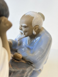 A Chinese polychrome-glazed Shiwan stoneware figure of Tudigong, a 'Shoulao' group and a 'Go Players' group, China marks, 19/20th C.